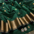 Dark green Maheshwari saree with flower motifs all over