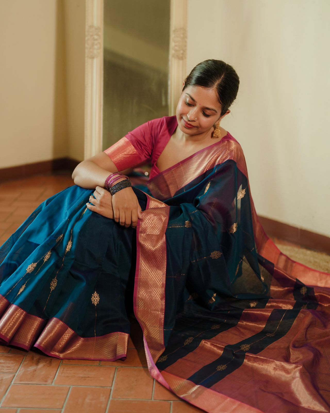 Peacock blue and pink Maheshwari saree with zari motifs all over