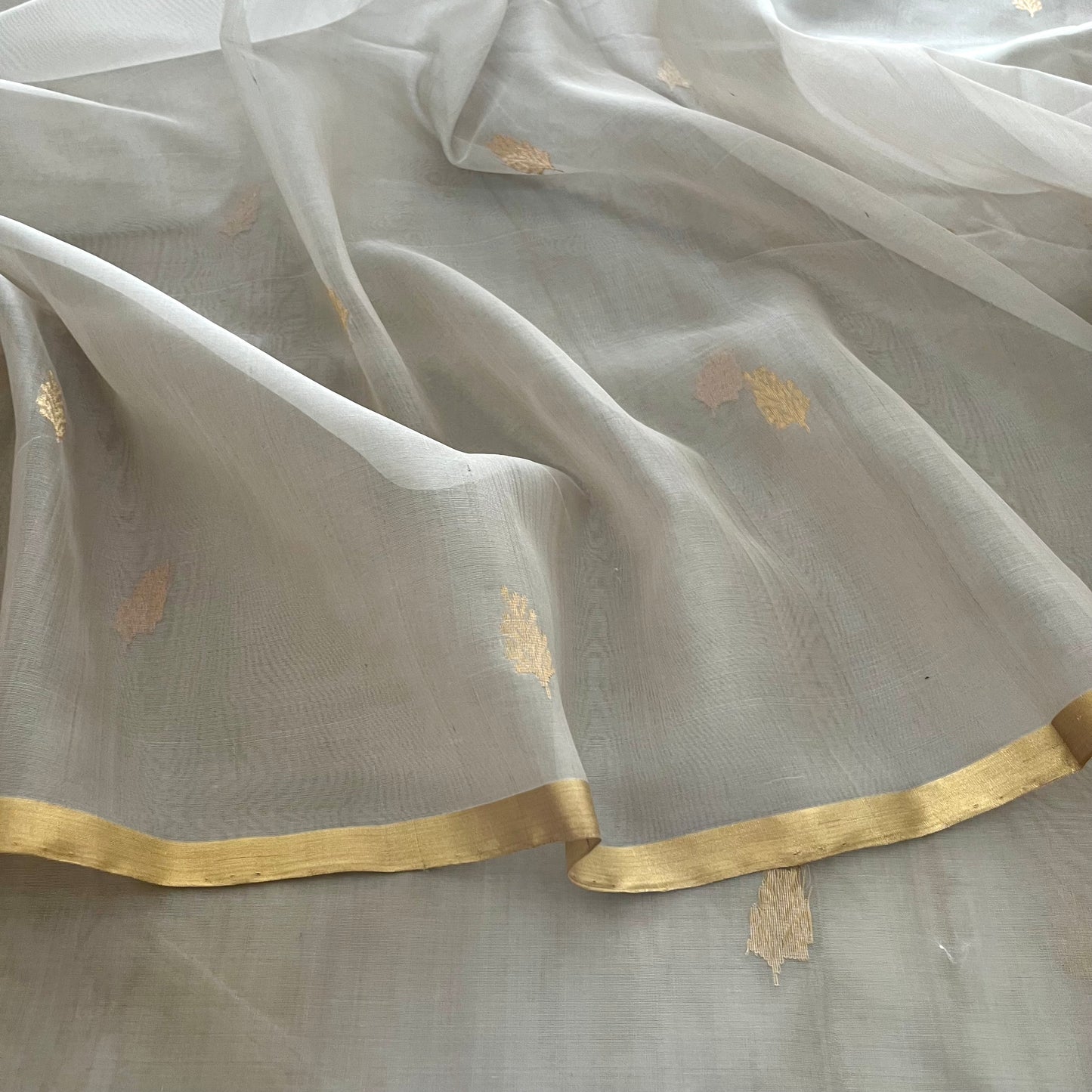 Light grey Chanderi organza silk saree with zari motifs all over