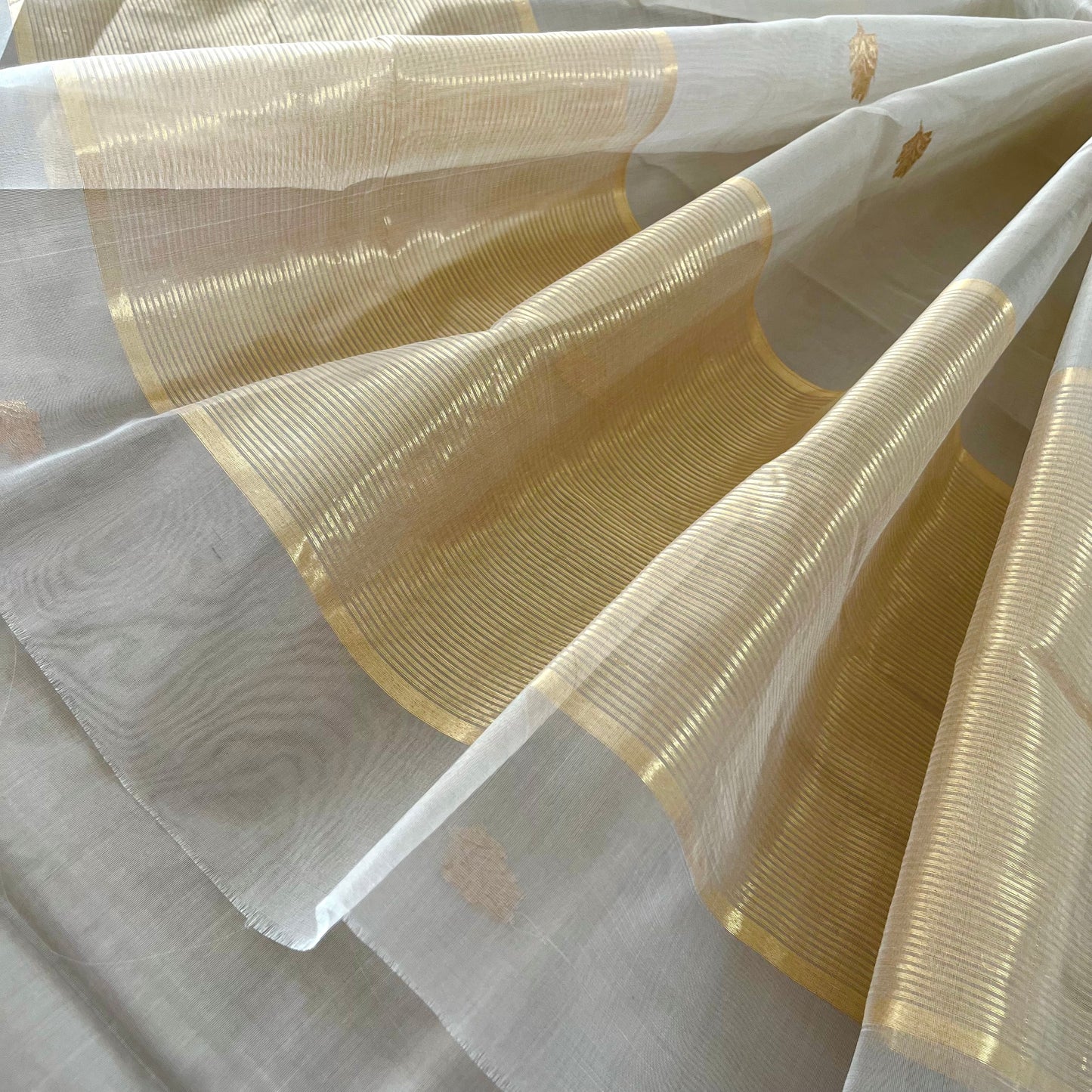 Light grey Chanderi organza silk saree with zari motifs all over