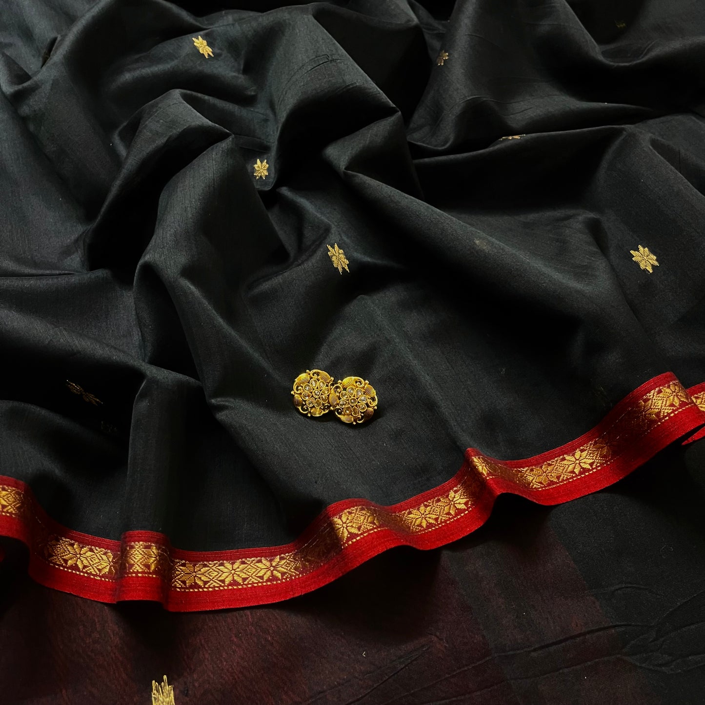 Black and maroon Maheshwari saree with flower bootis all over