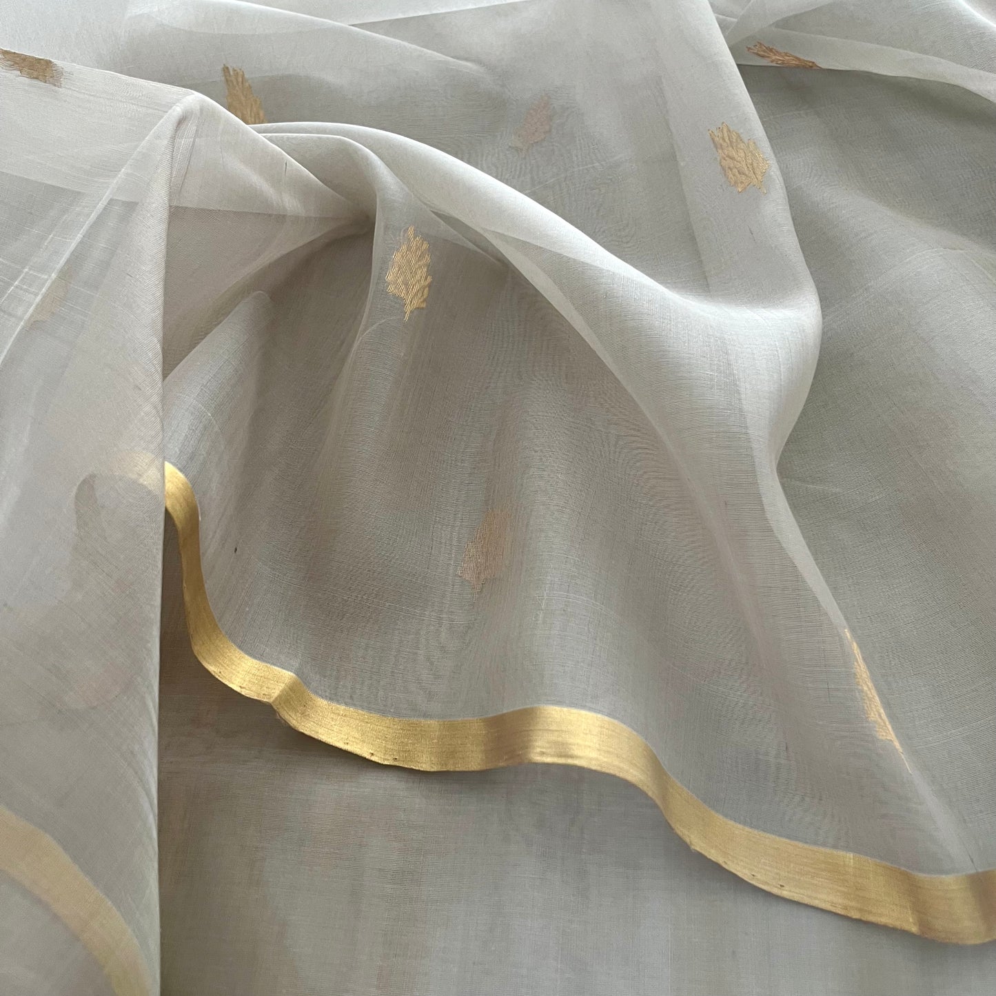 Light grey Chanderi organza silk saree with zari motifs all over