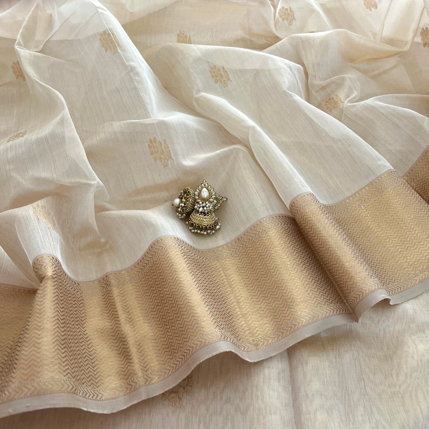 Cream gold Maheshwari tissue silk saree with flower motifs all over