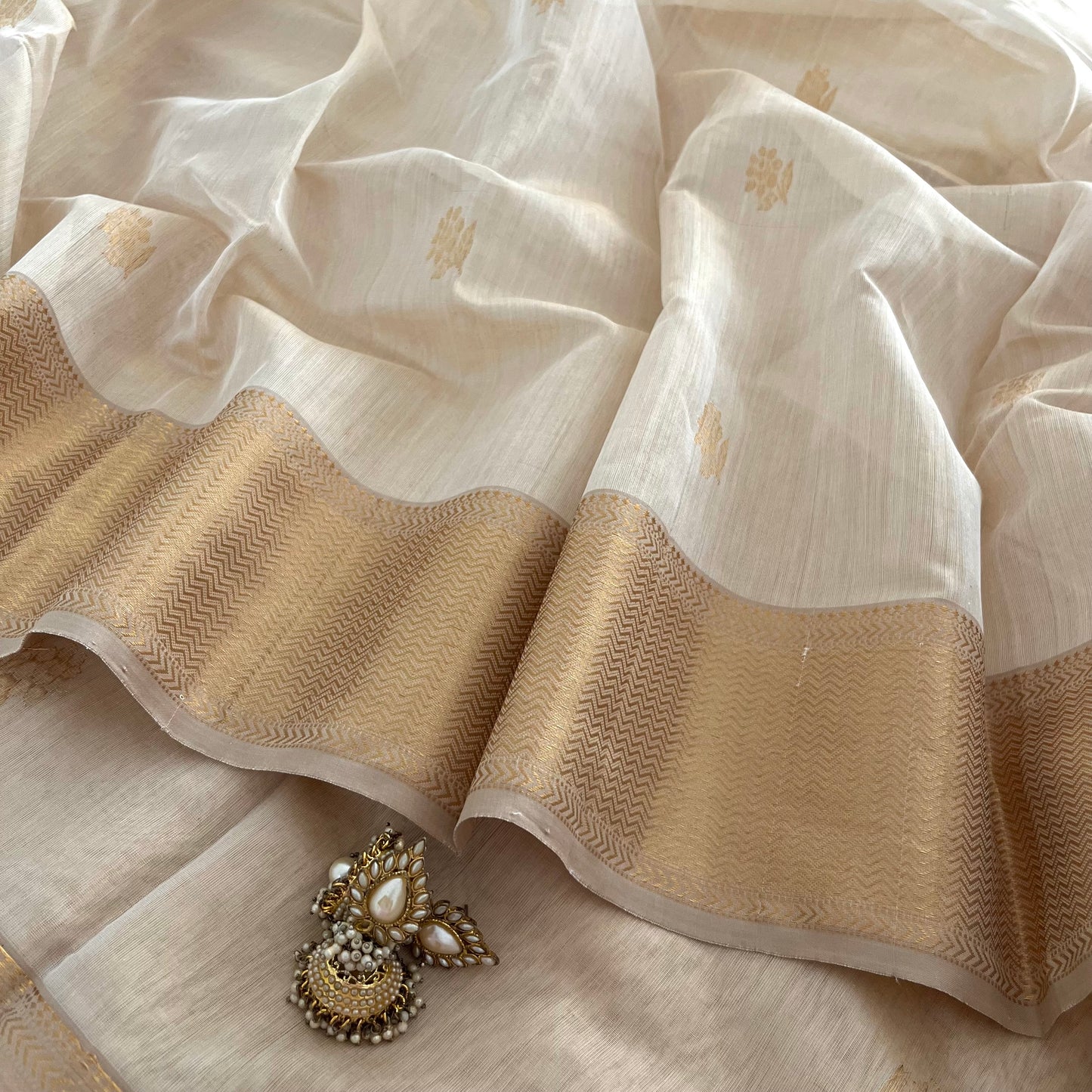 Cream gold Maheshwari tissue silk saree with flower motifs all over