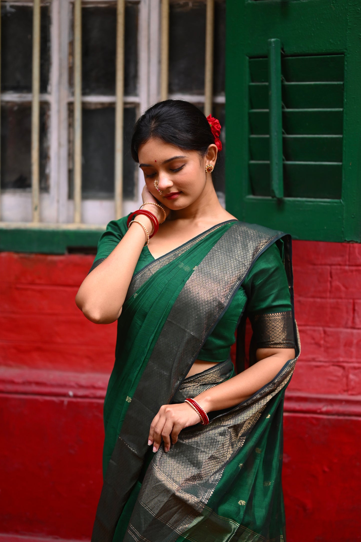 Dark green maheshwari with saree with flower bootis all over