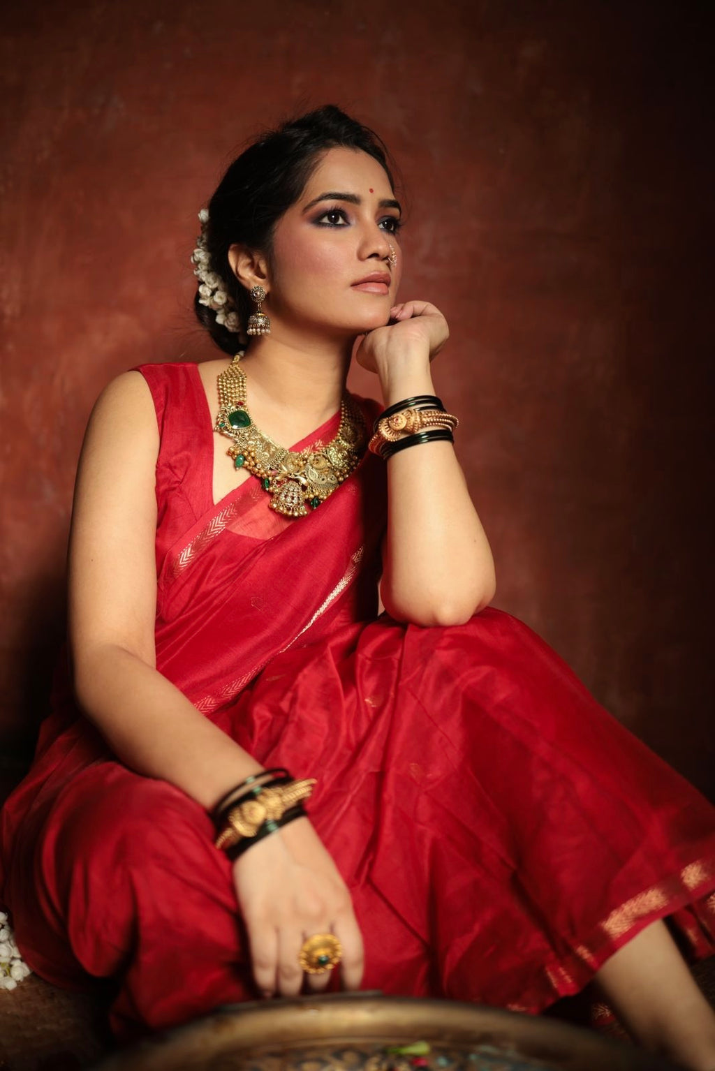 Red maheshwari saree with zari border & zari bootis all over