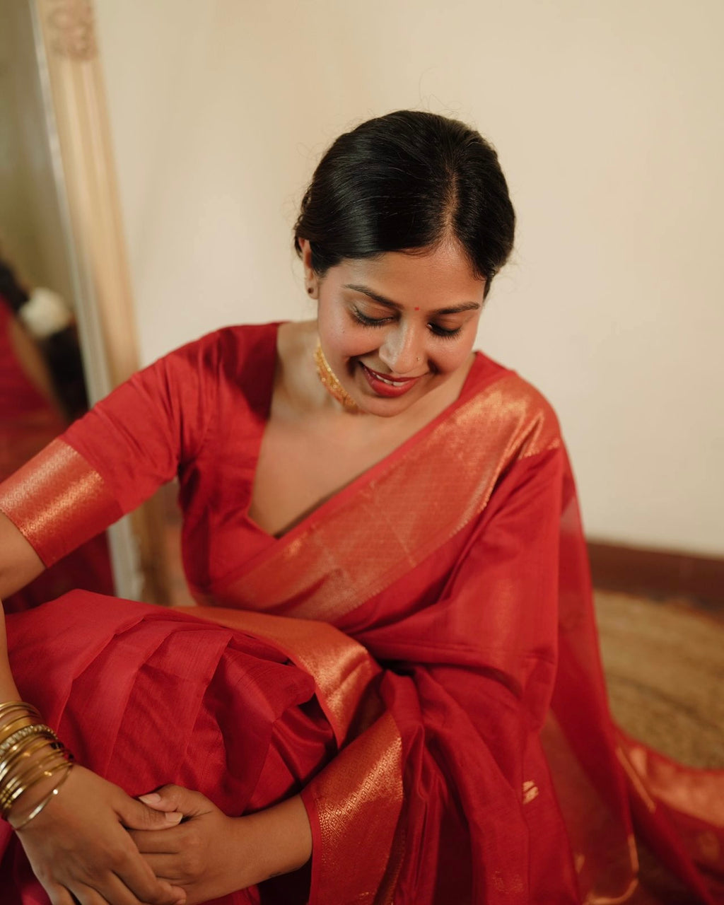 Red Maheshwari saree with morni motifs all over
