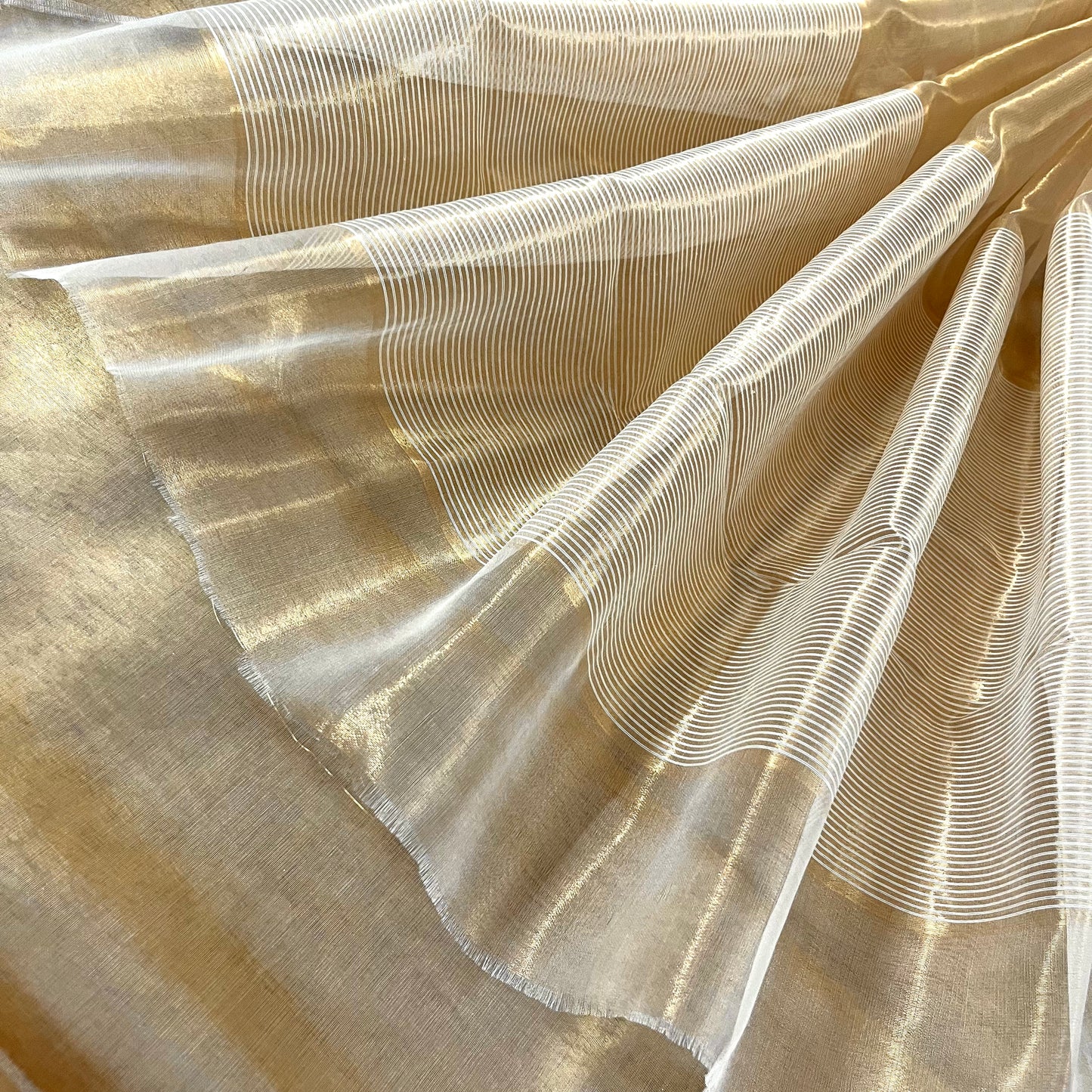 Molten gold chanderi tissue silk saree with zari lines on pallu