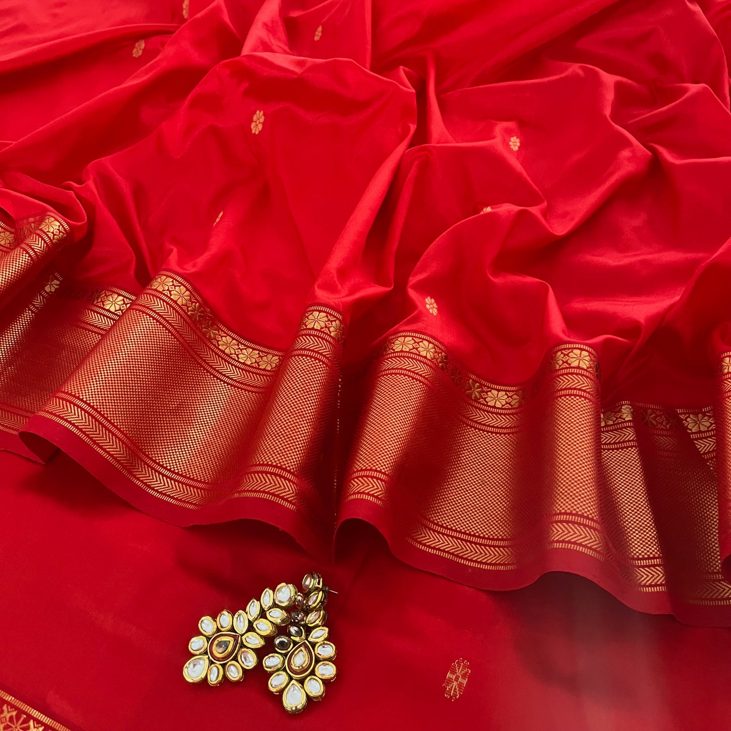 Deep Red Maheshwari silk saree with flower bootis all over