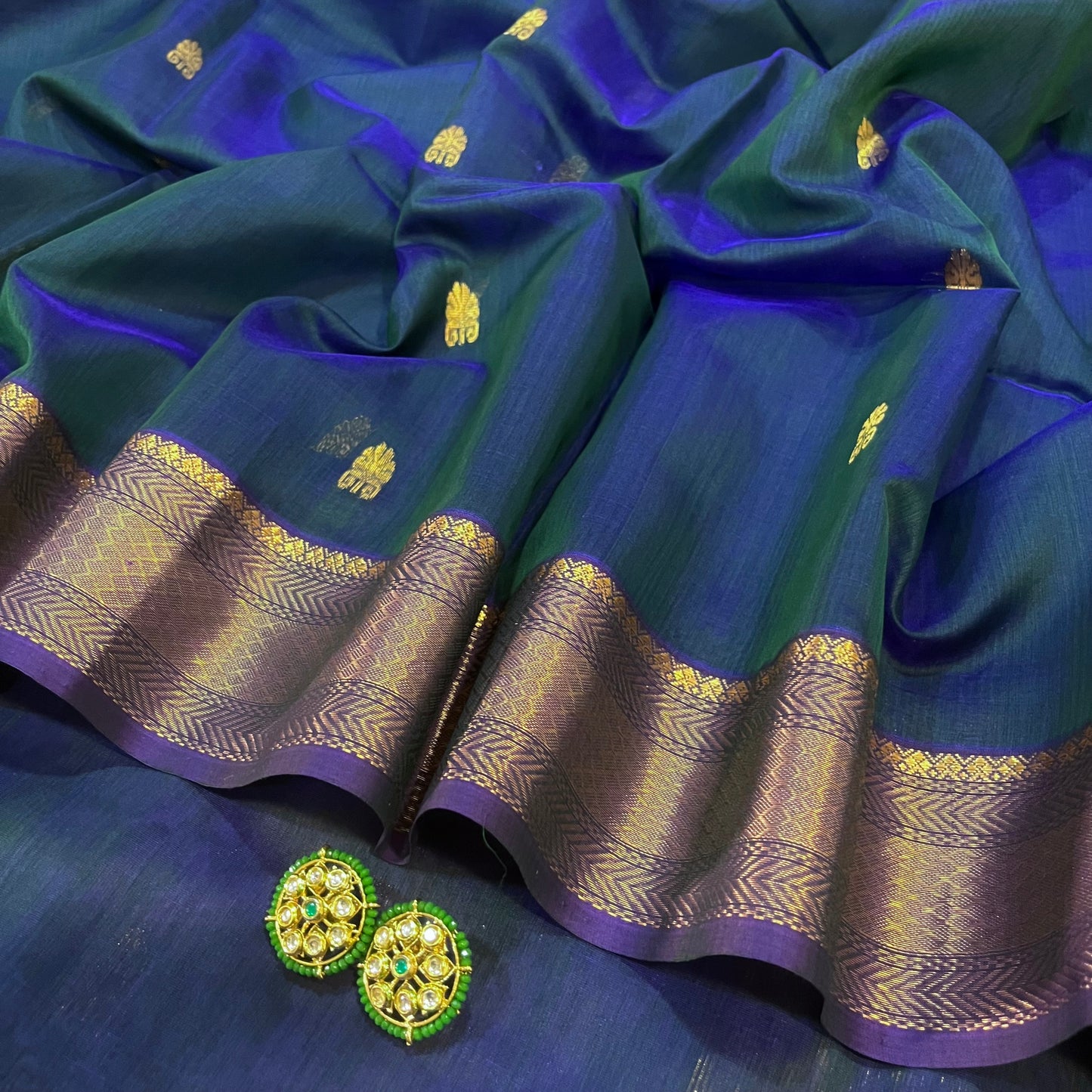 Peacock and purple dual tone Maheshwari saree with zari motifs all over
