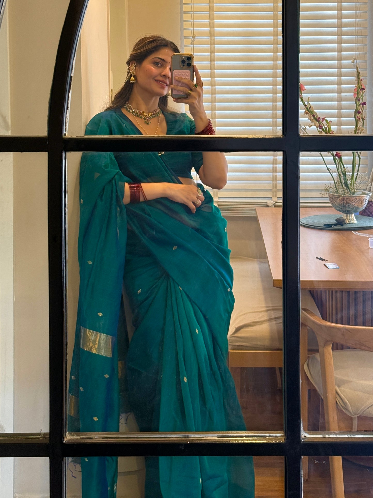 Peacock green and blue dual tone Maheshwari saree with zari bootis all over
