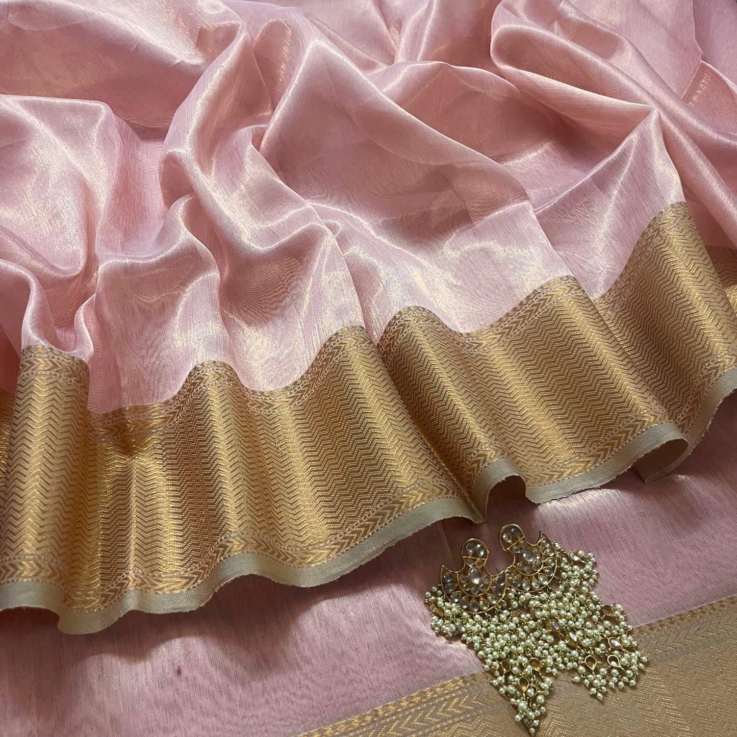 Peachish pink maheshwari tissue silk saree with zari pattern on pallu