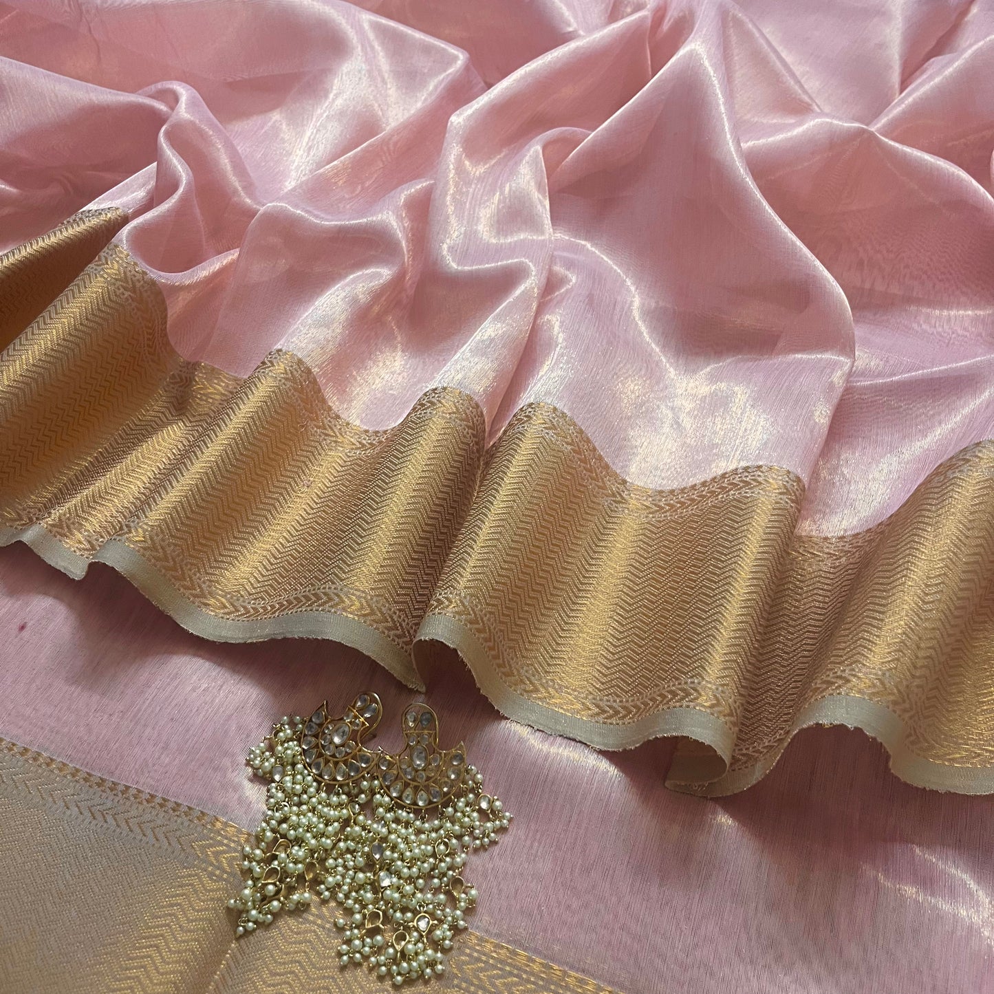 Peachish pink maheshwari tissue silk saree with zari pattern on pallu