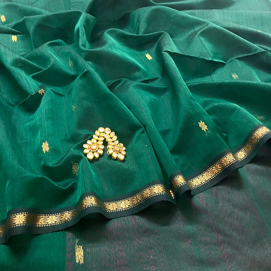 Bottle green and pink maheshwari saree with flower bootis all over