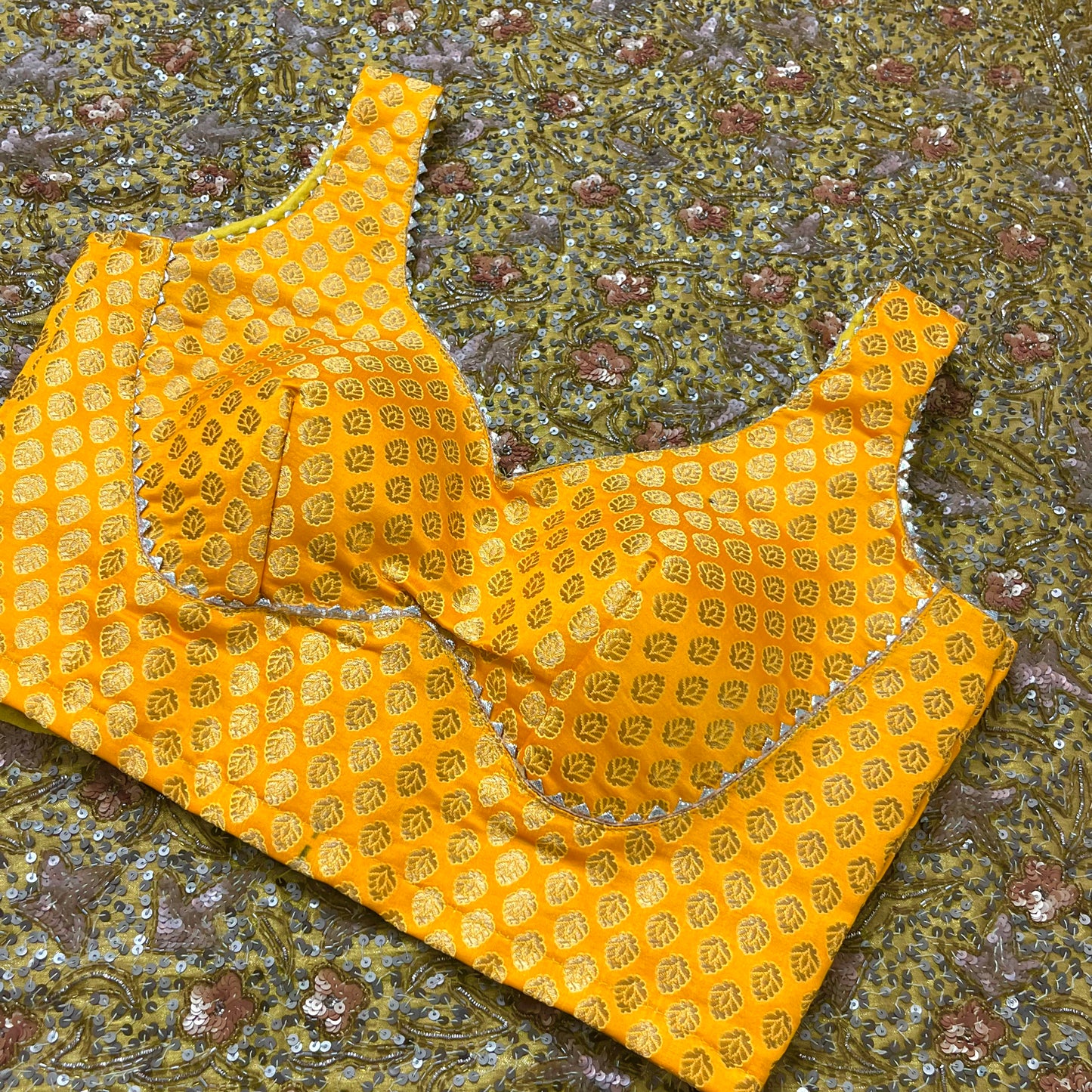 Yellow stitched padded brocade silk blouse with gota border