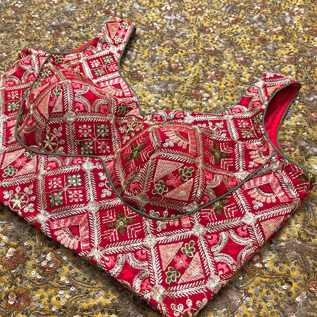 Red stitched padded blouse with threadwork all over