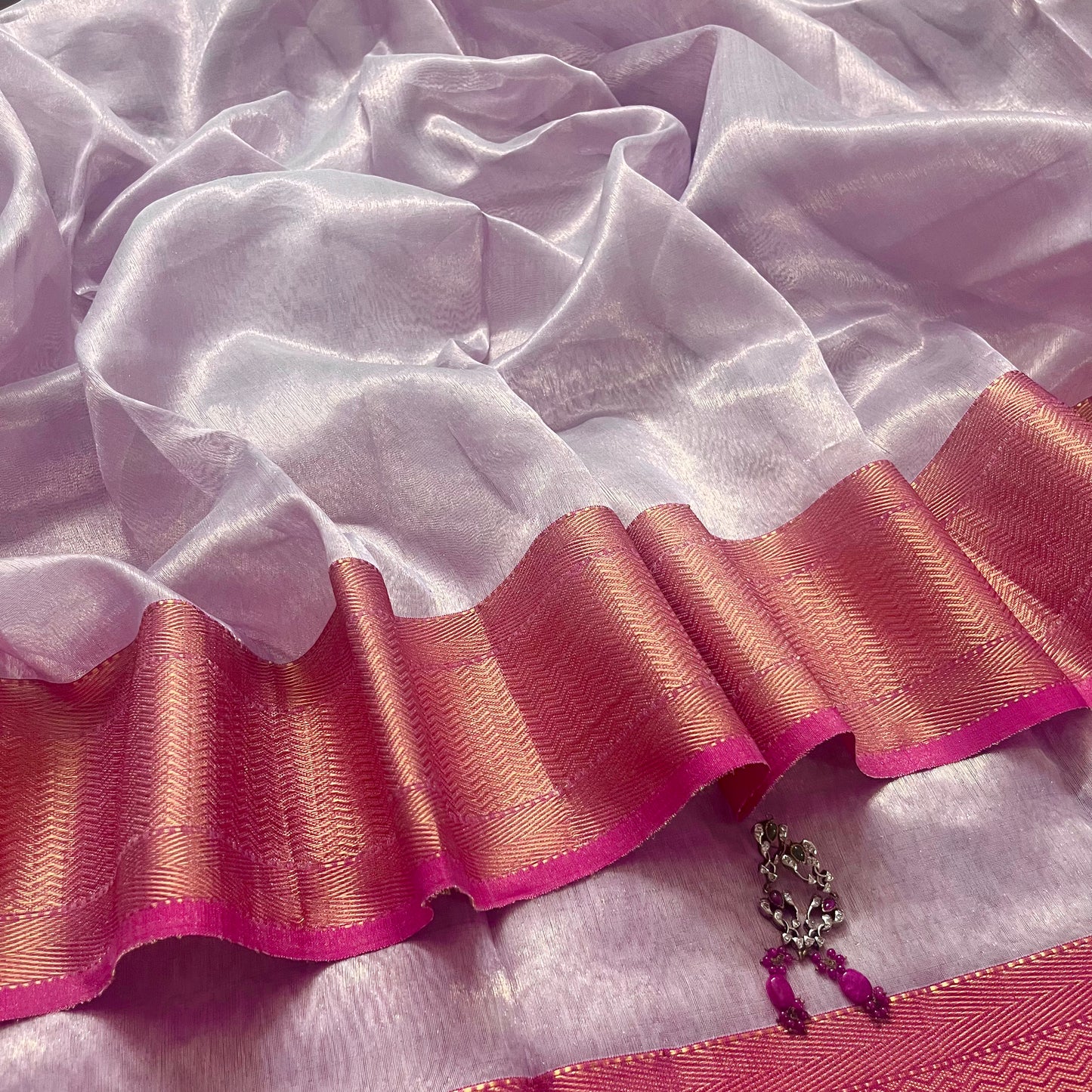 Mauve and pink maheshwari tissue silk saree with zari pattern on pallu