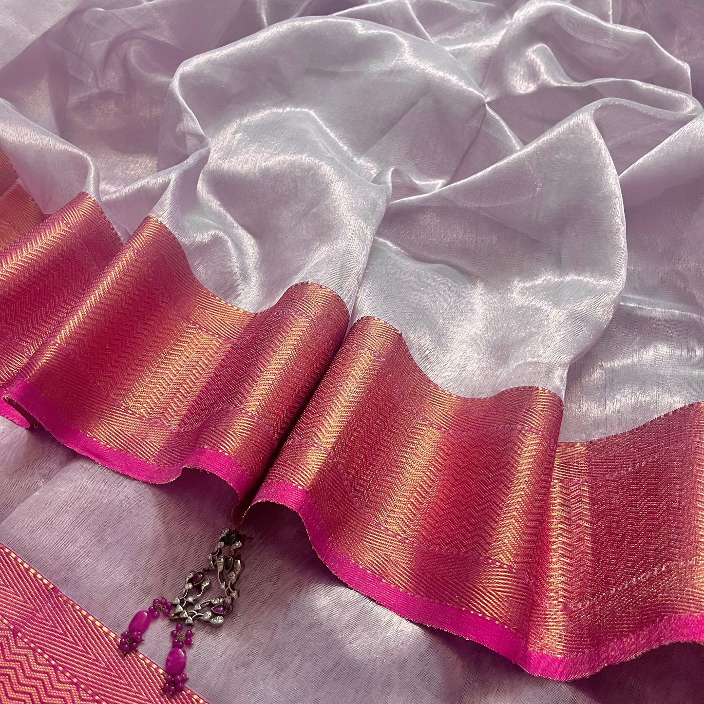 Mauve and pink maheshwari tissue silk saree with zari pattern on pallu