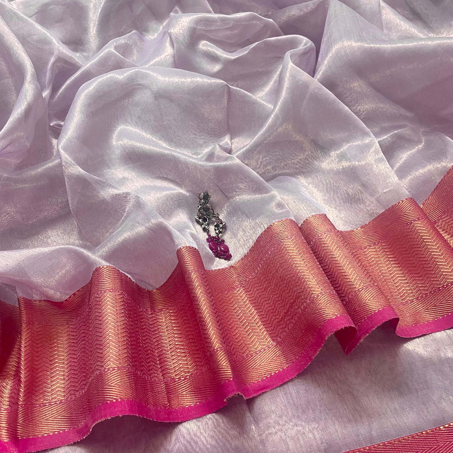 Mauve and pink maheshwari tissue silk saree with zari pattern on pallu