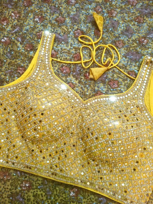 Yellow stitched blouse with mirror work
