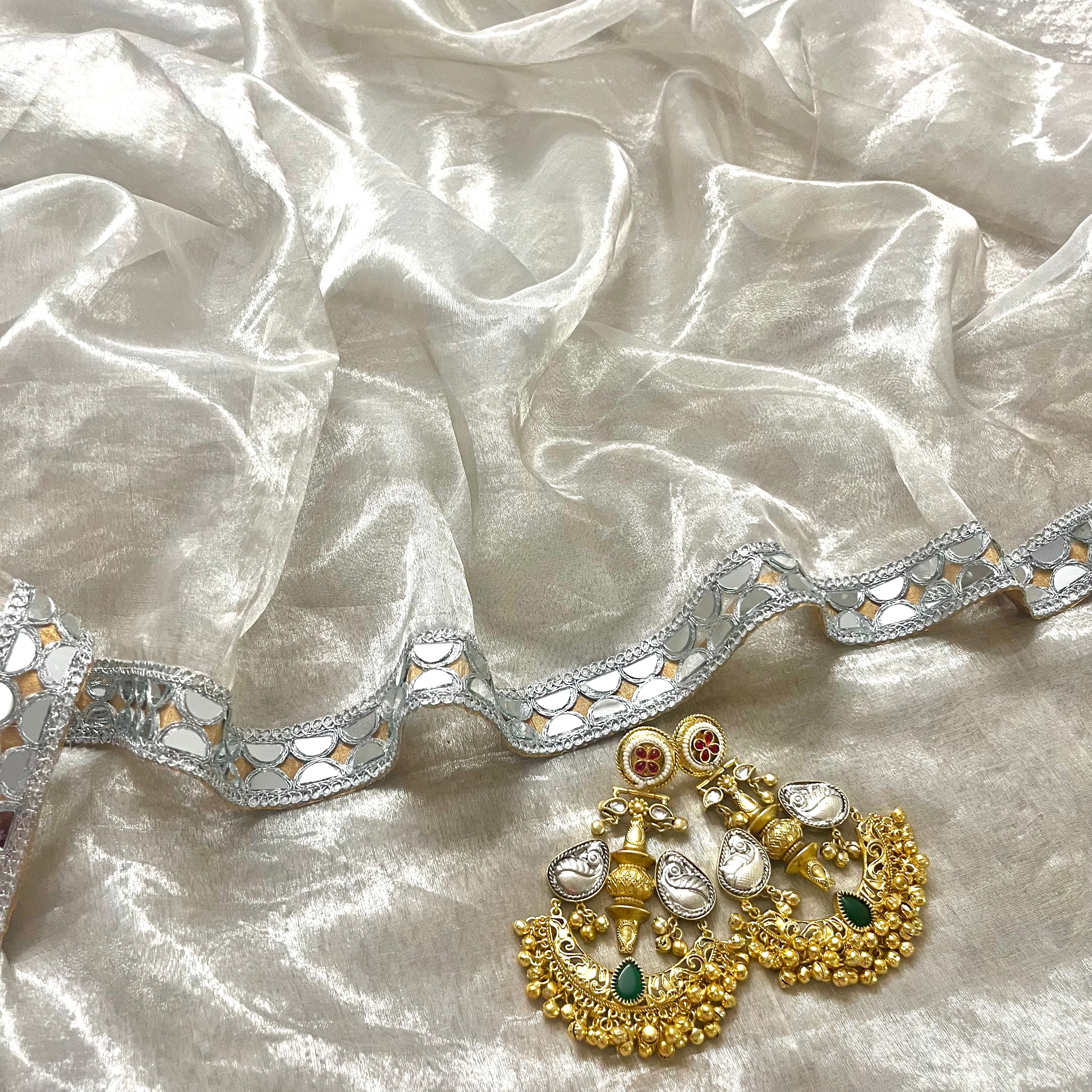 Molten silver and gold chanderi tissue silk saree with mirror work border