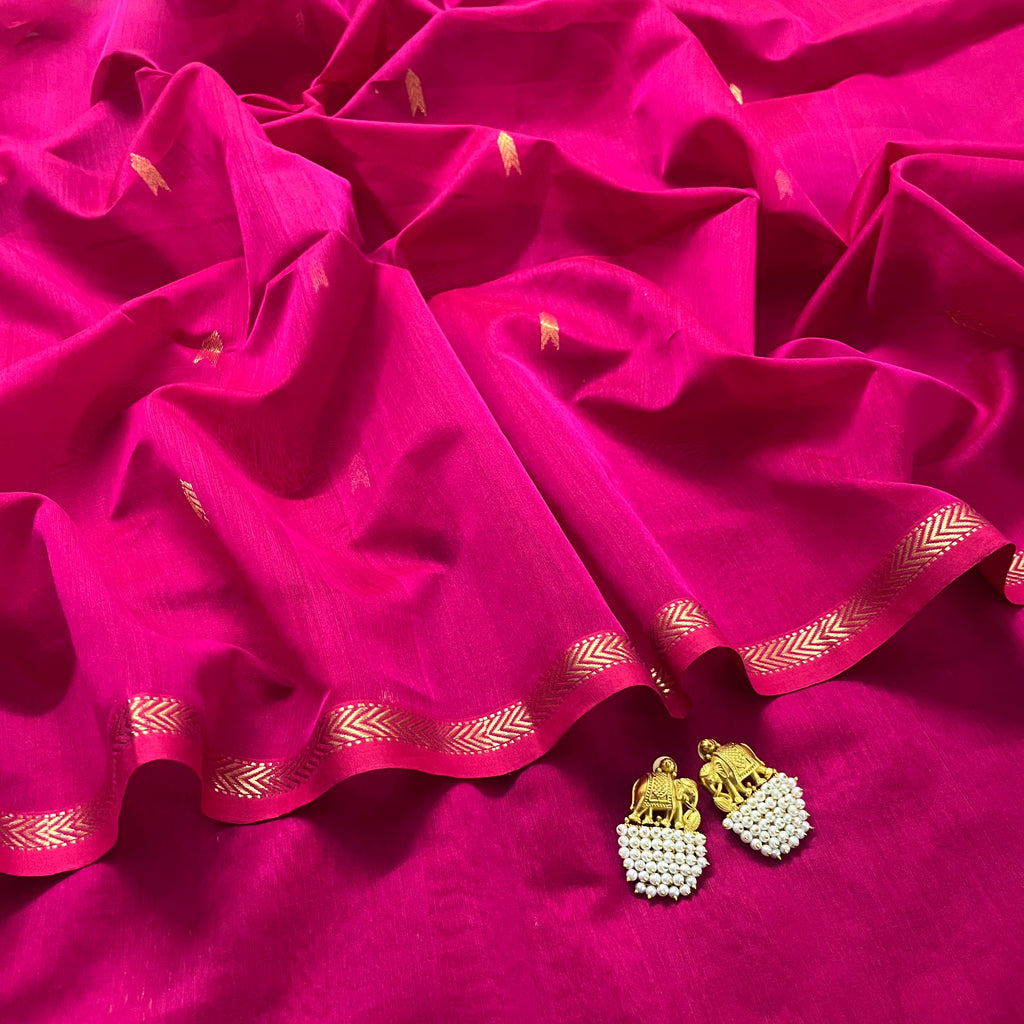 Rani pink maheshwari saree with zari border and zari bootis all over