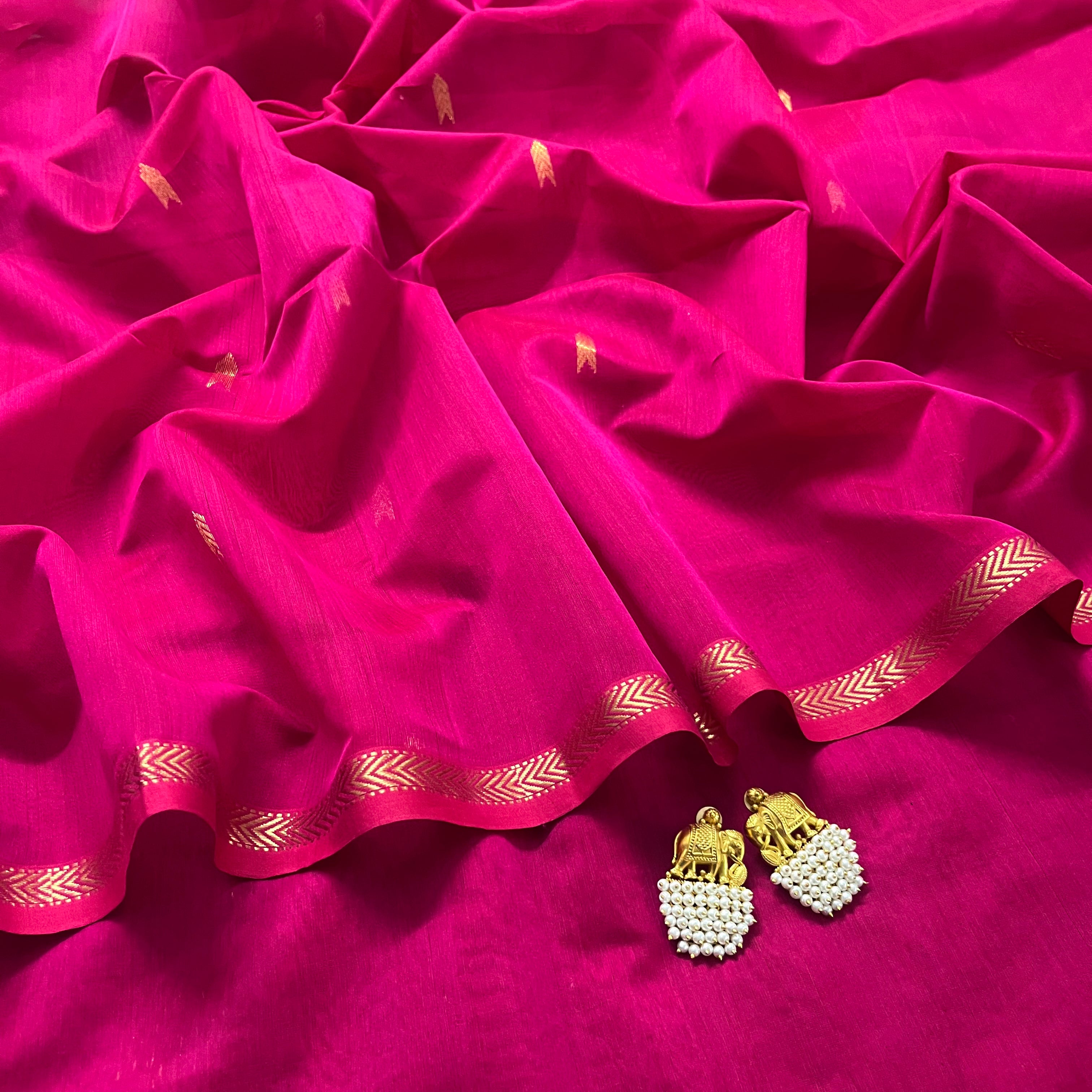Rani pink maheshwari saree with zari border and zari bootis all over