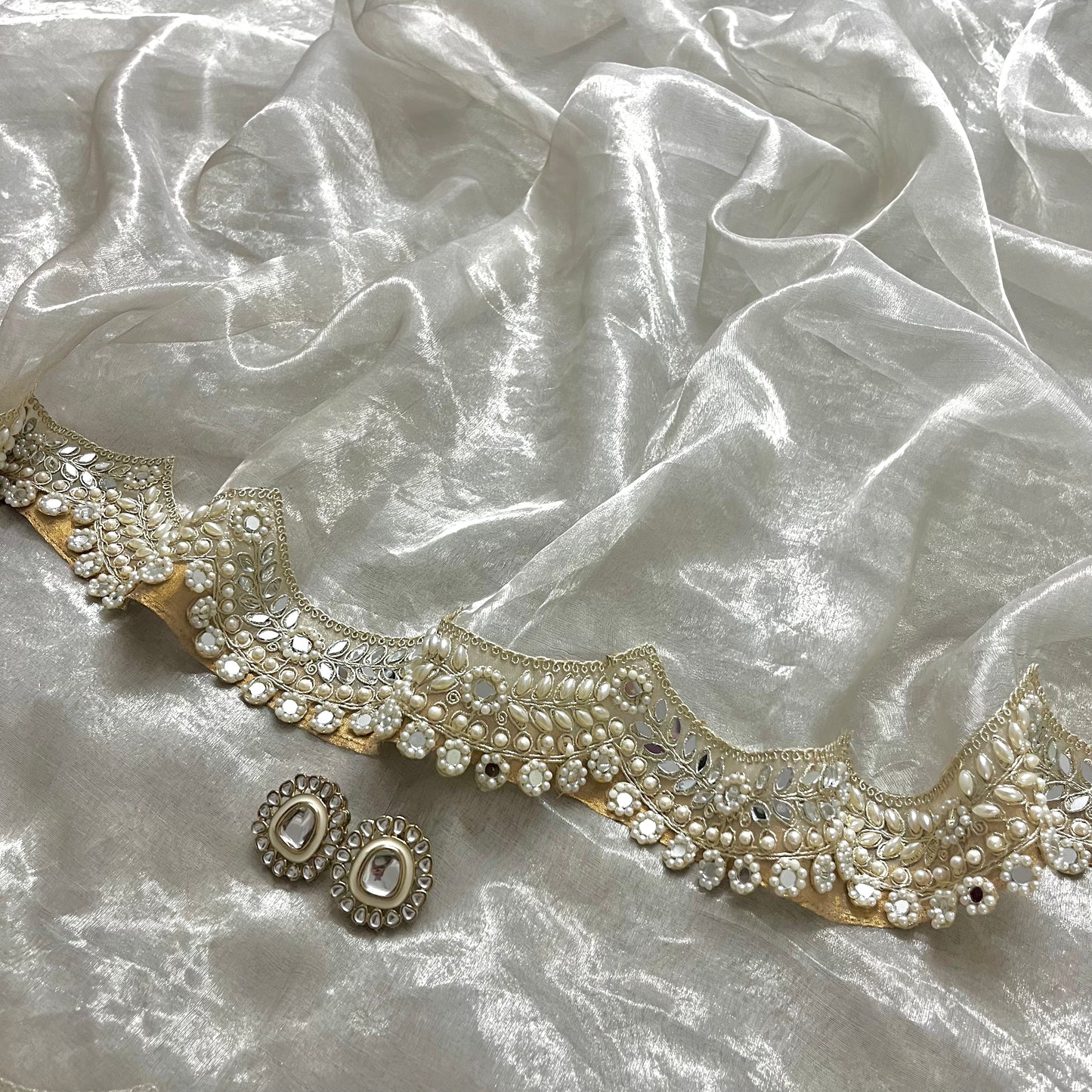 Molten silver chanderi tissue silk saree with pearl and mirror work border