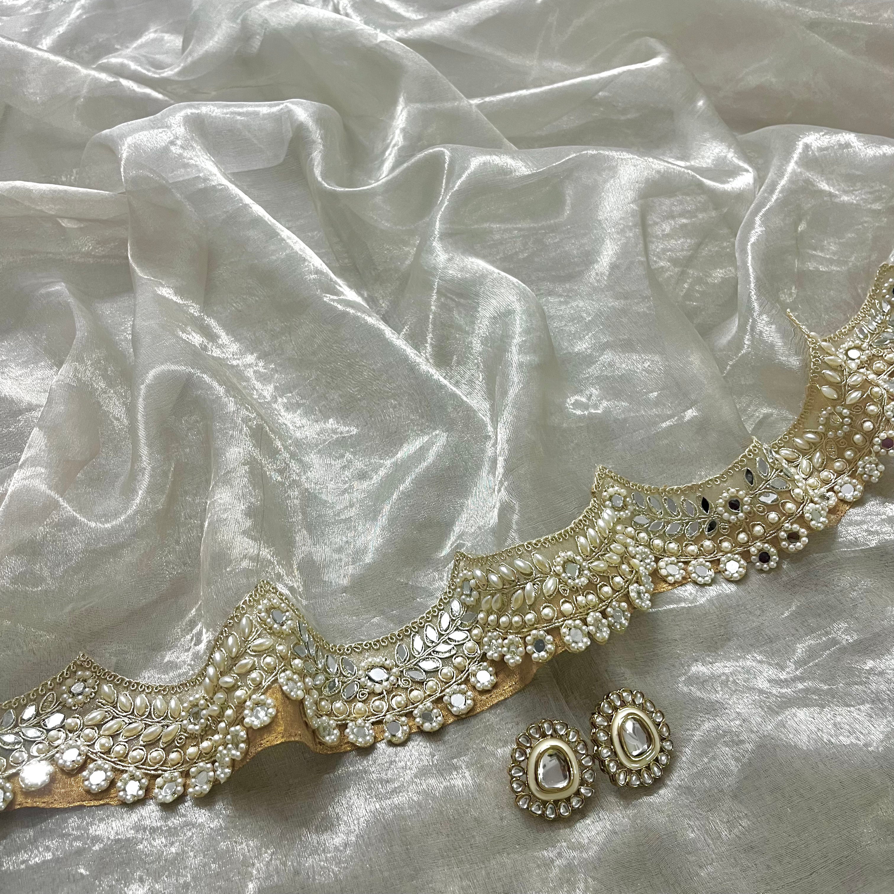 Molten silver chanderi tissue silk saree with pearl and mirror work border