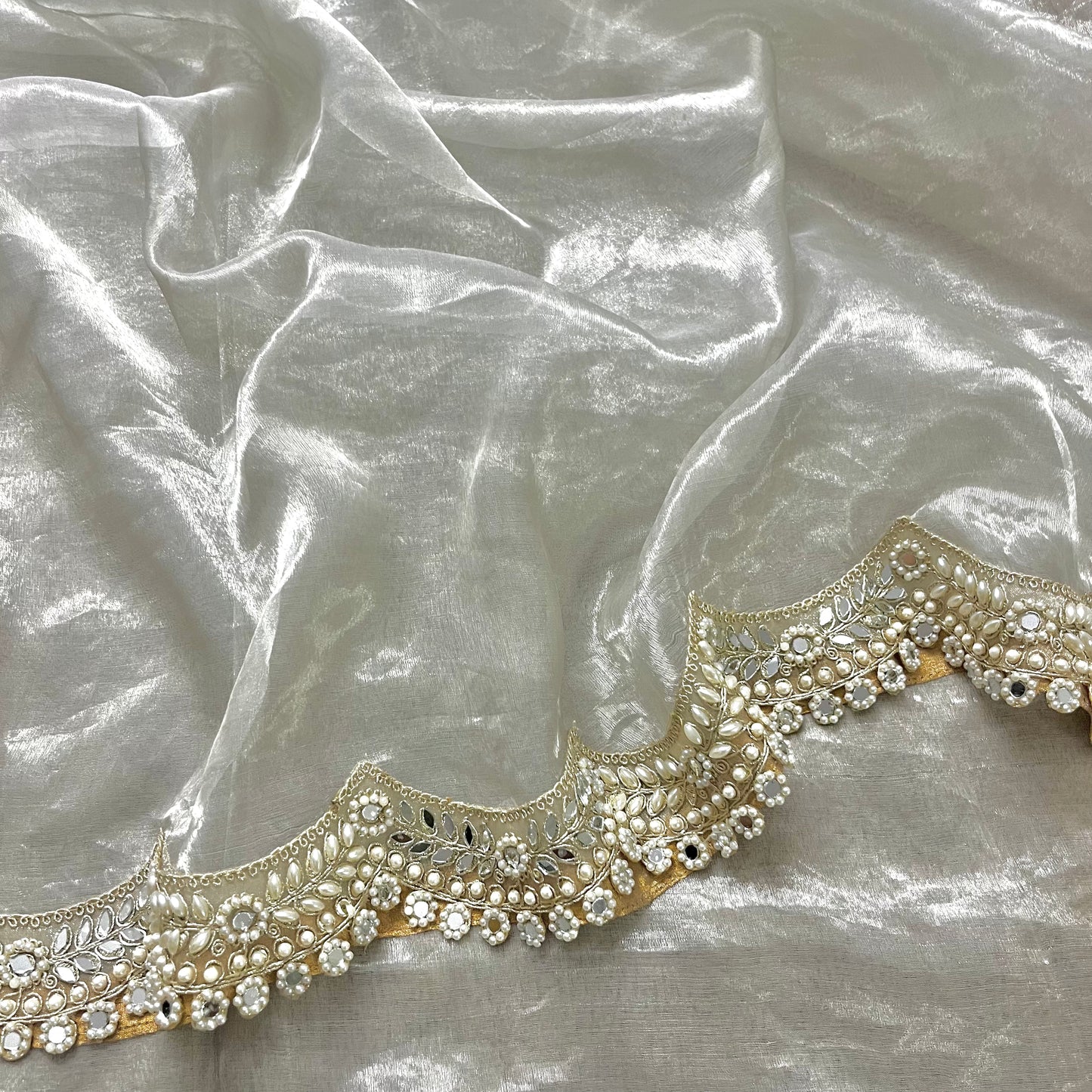 Molten silver chanderi tissue silk saree with pearl and mirror work border