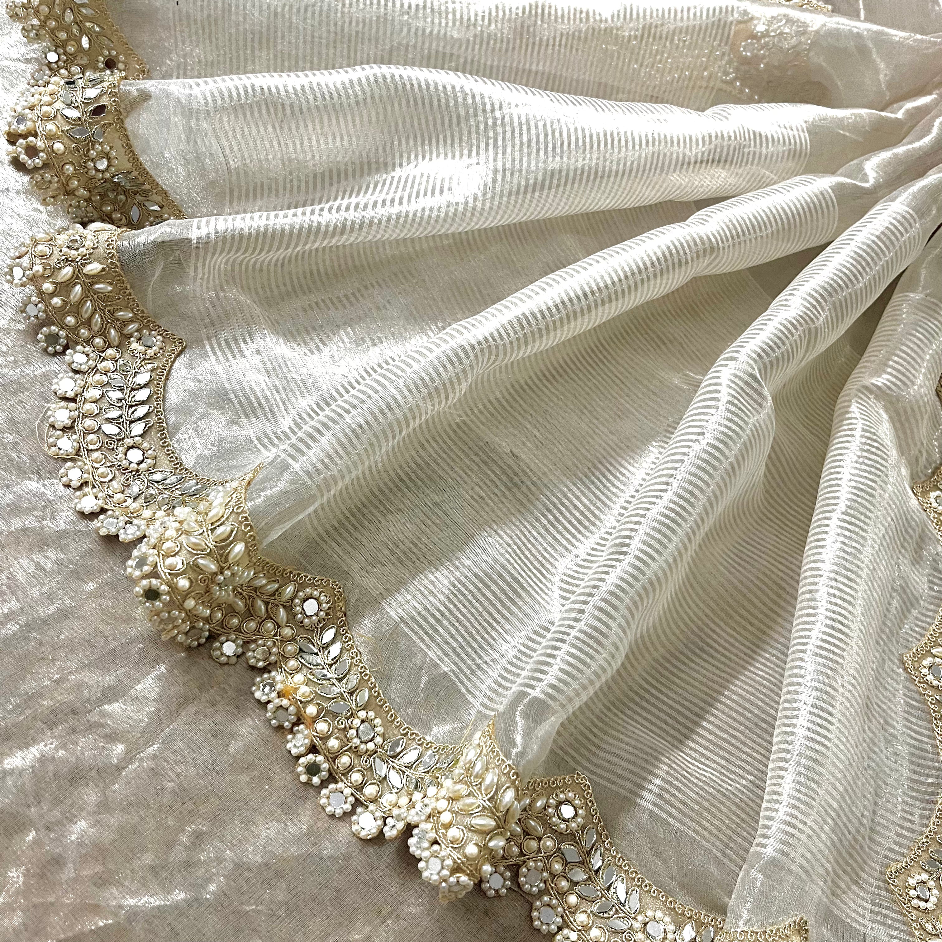 Molten silver chanderi tissue silk saree with pearl and mirror work border