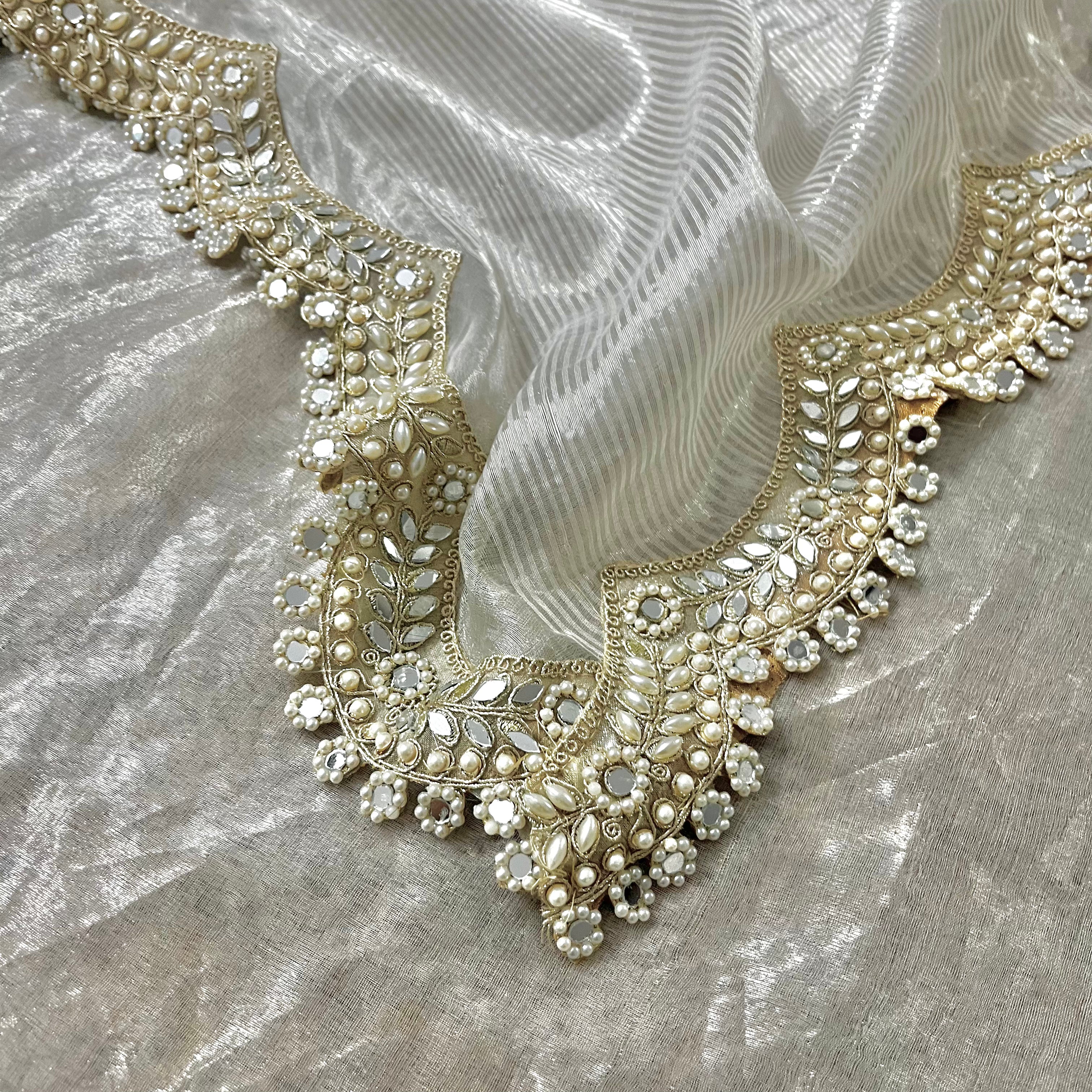 Molten silver chanderi tissue silk saree with pearl and mirror work border