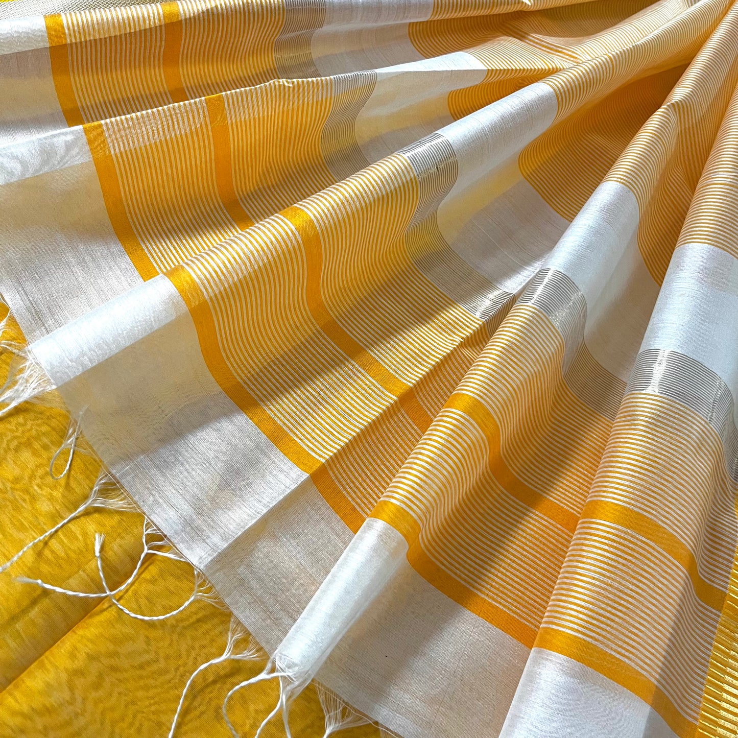 White and yellow maheshwari saree with resham border