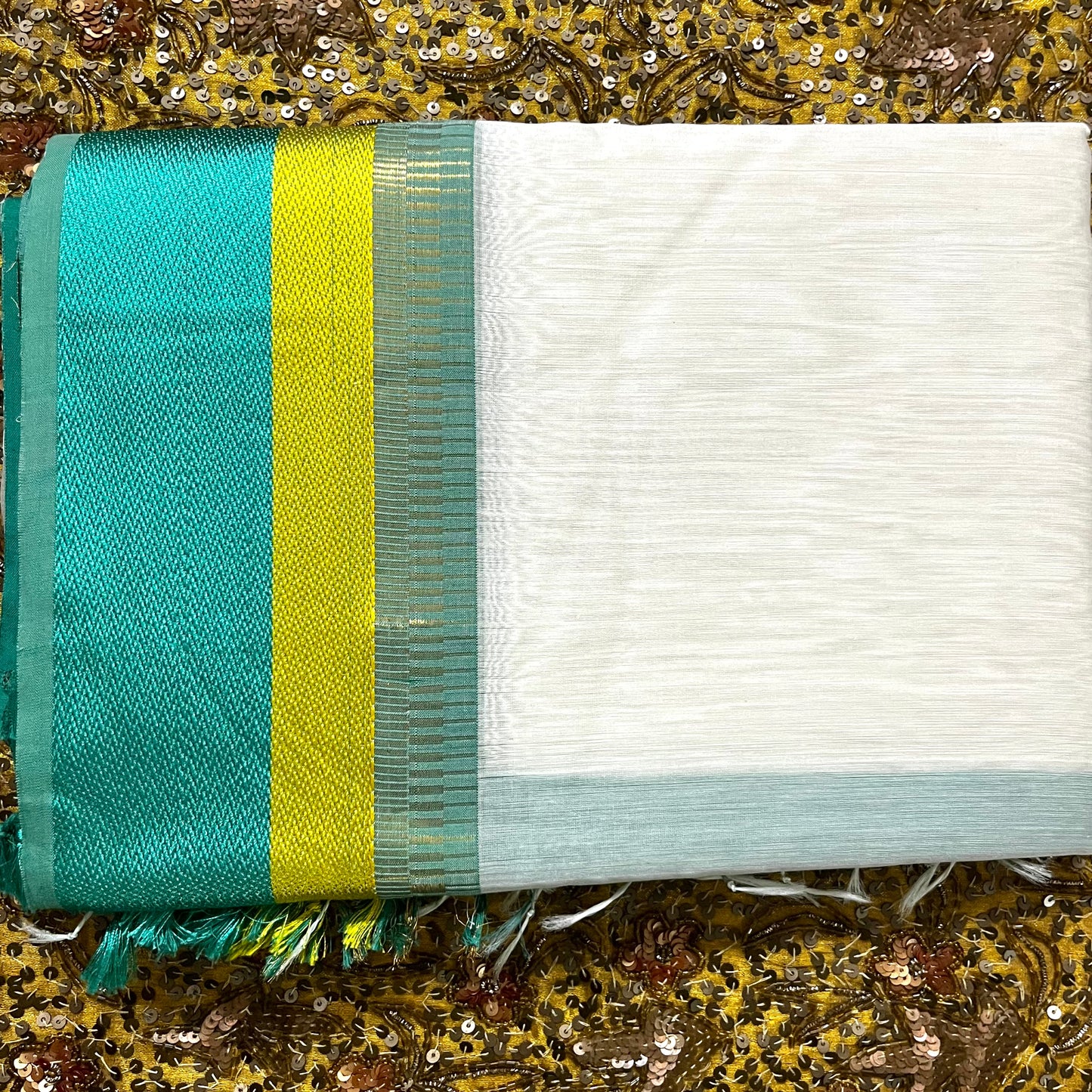 White and turquoise maheshwari saree with resham border