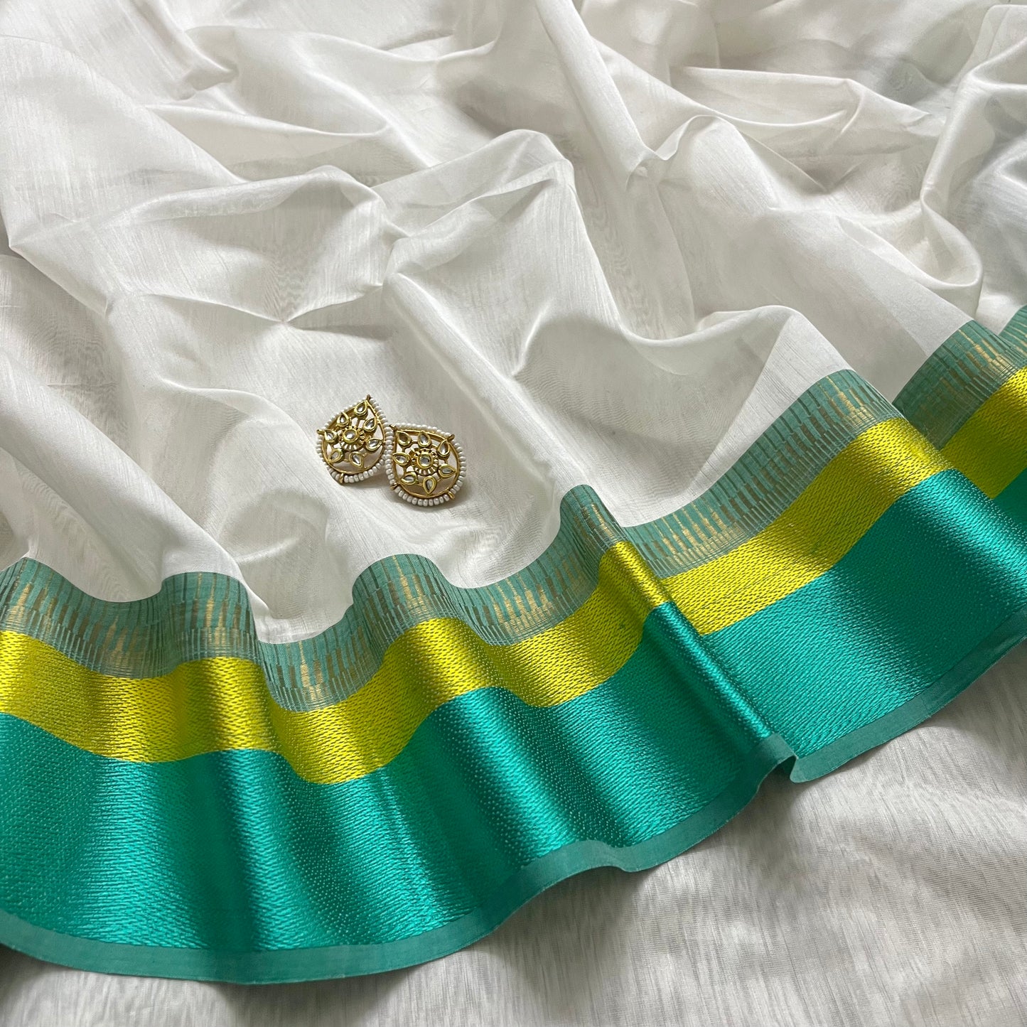 White and turquoise maheshwari saree with resham border