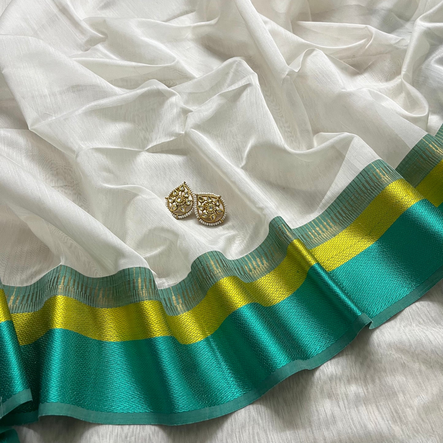 White and turquoise maheshwari saree with resham border