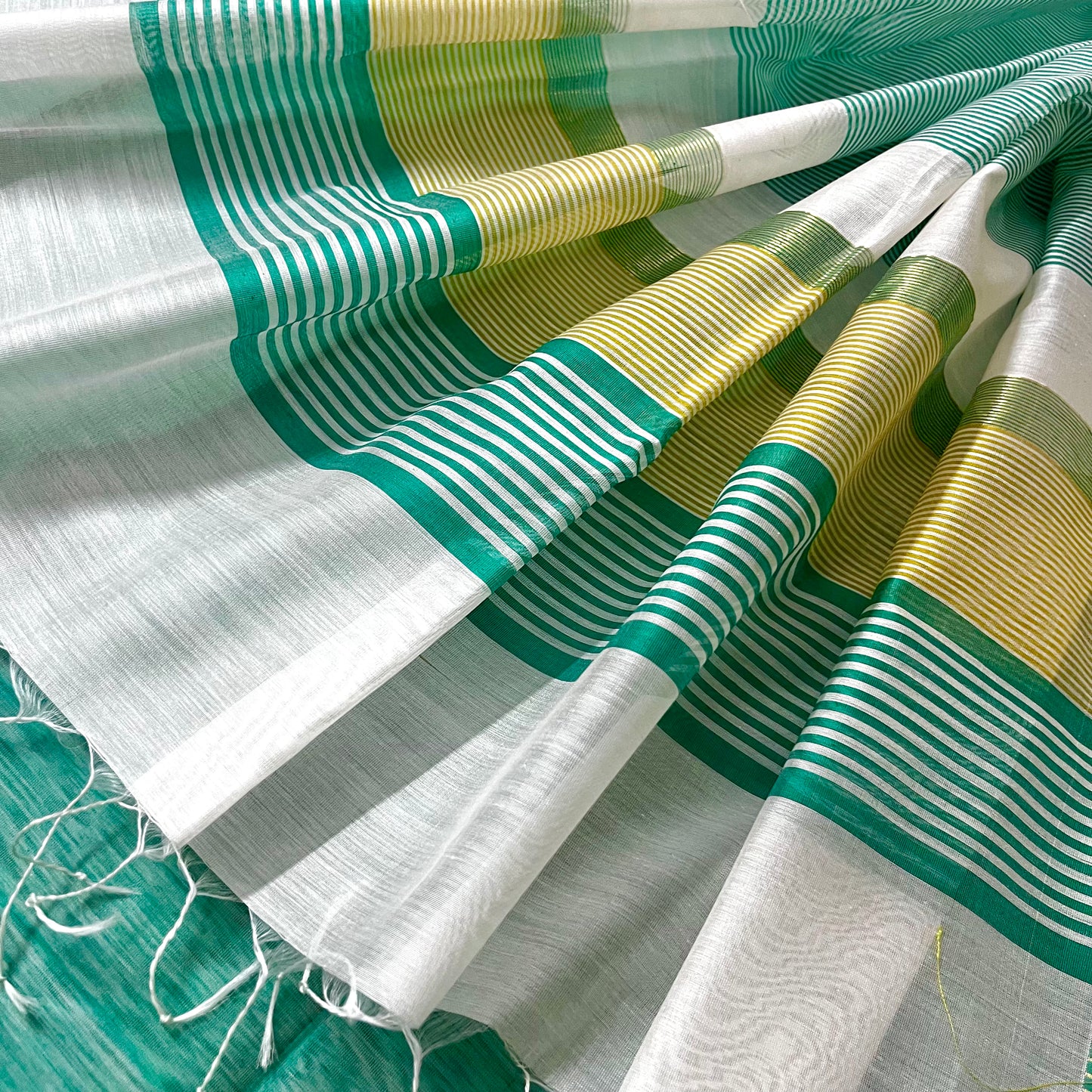 White and turquoise maheshwari saree with resham border