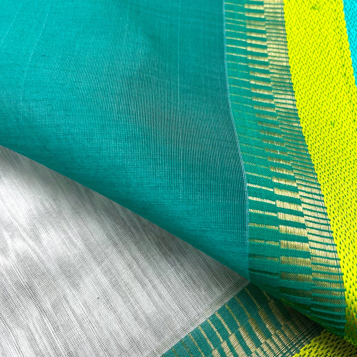White and turquoise maheshwari saree with resham border