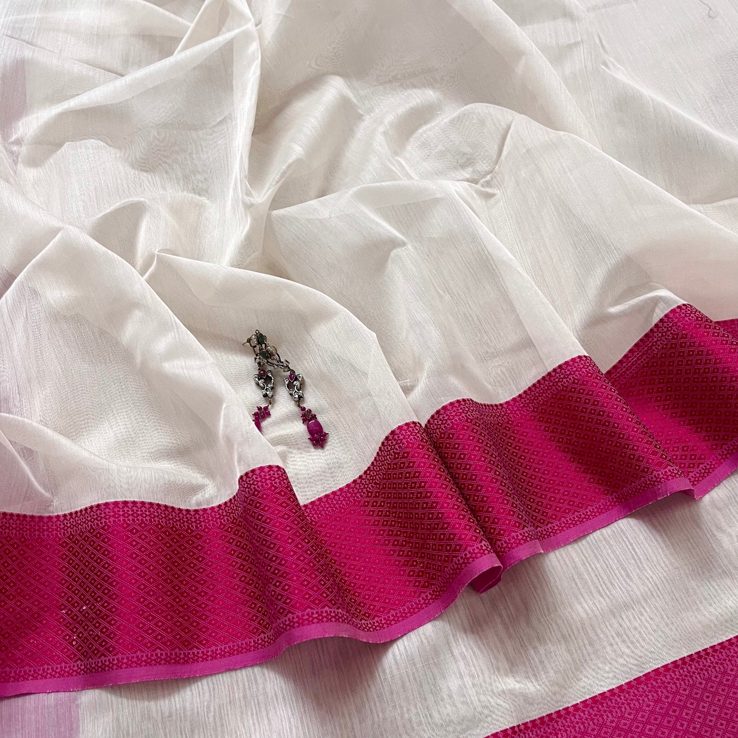 White and pink maheshwari saree with resham border