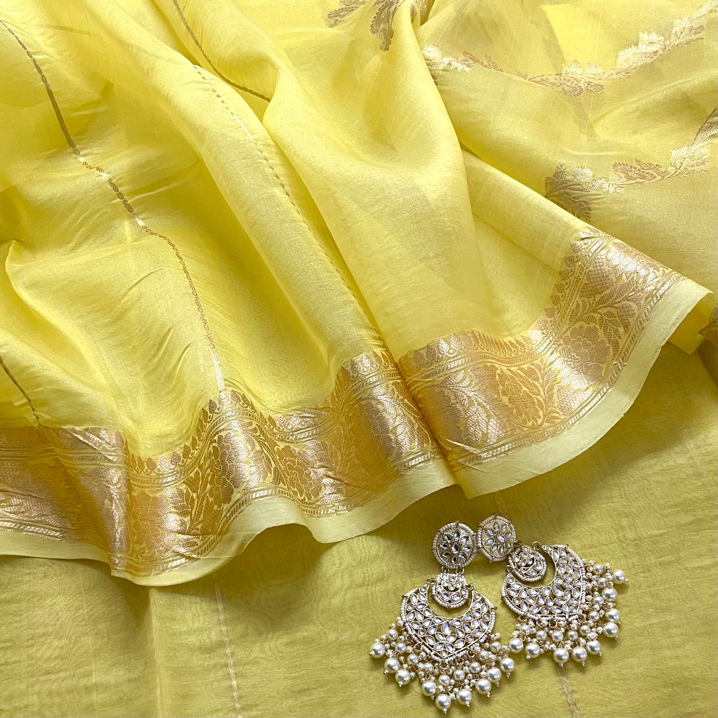 Light yellow banarasi silk saree with zari bel all over