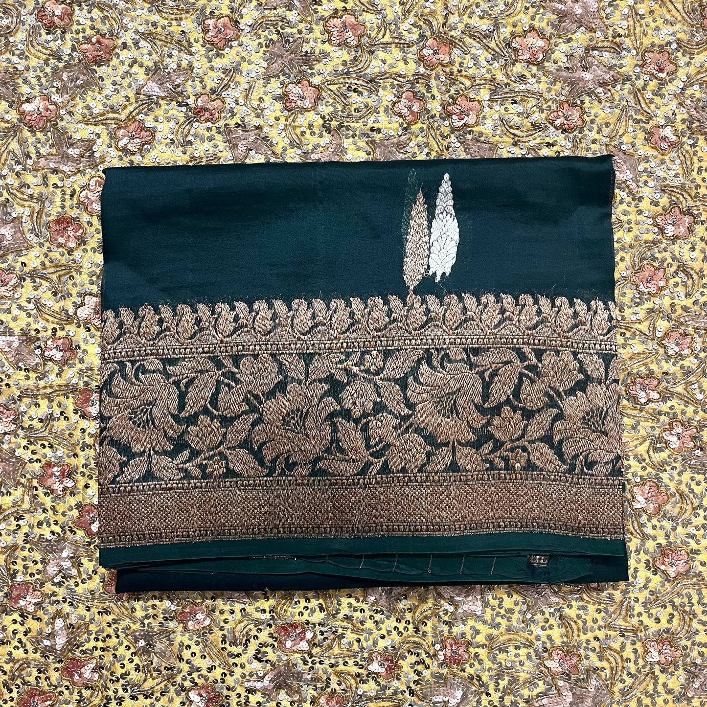 Dark green banarasi organza silk saree with zari motifs all over