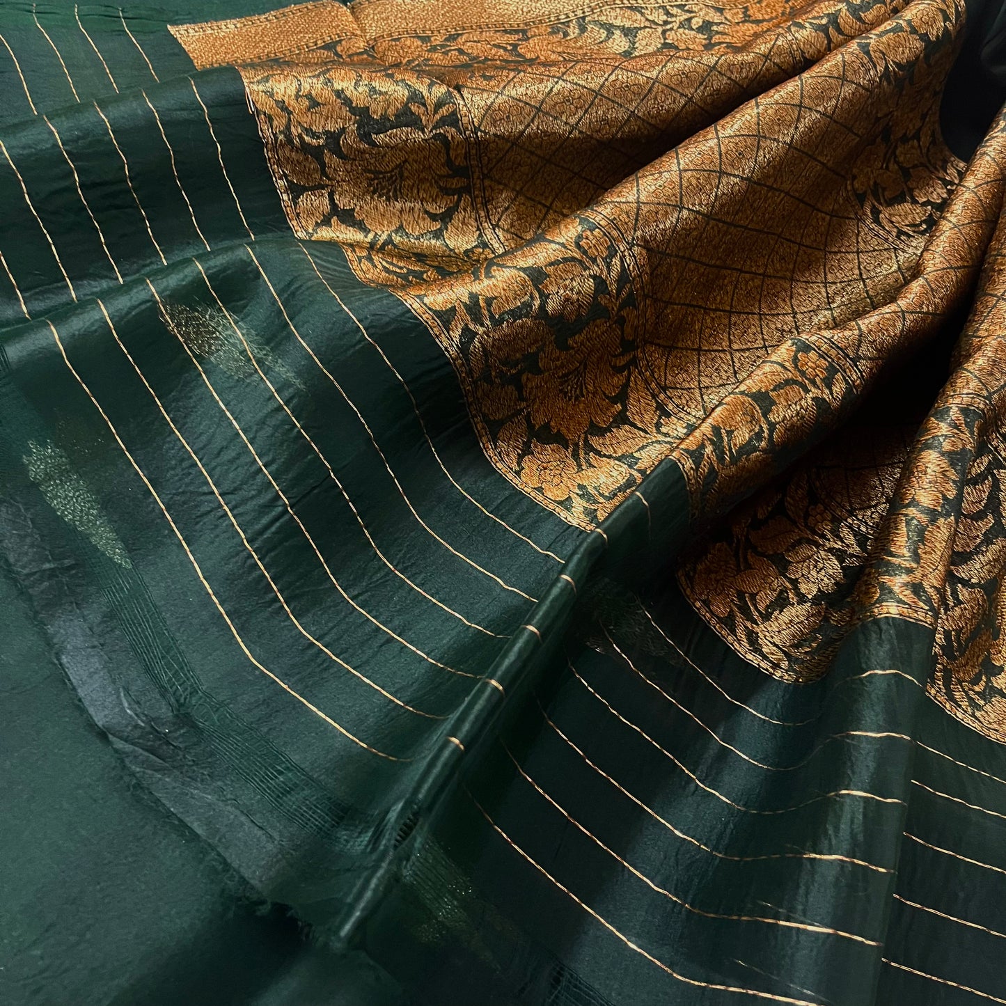 Dark green banarasi organza silk saree with zari motifs all over