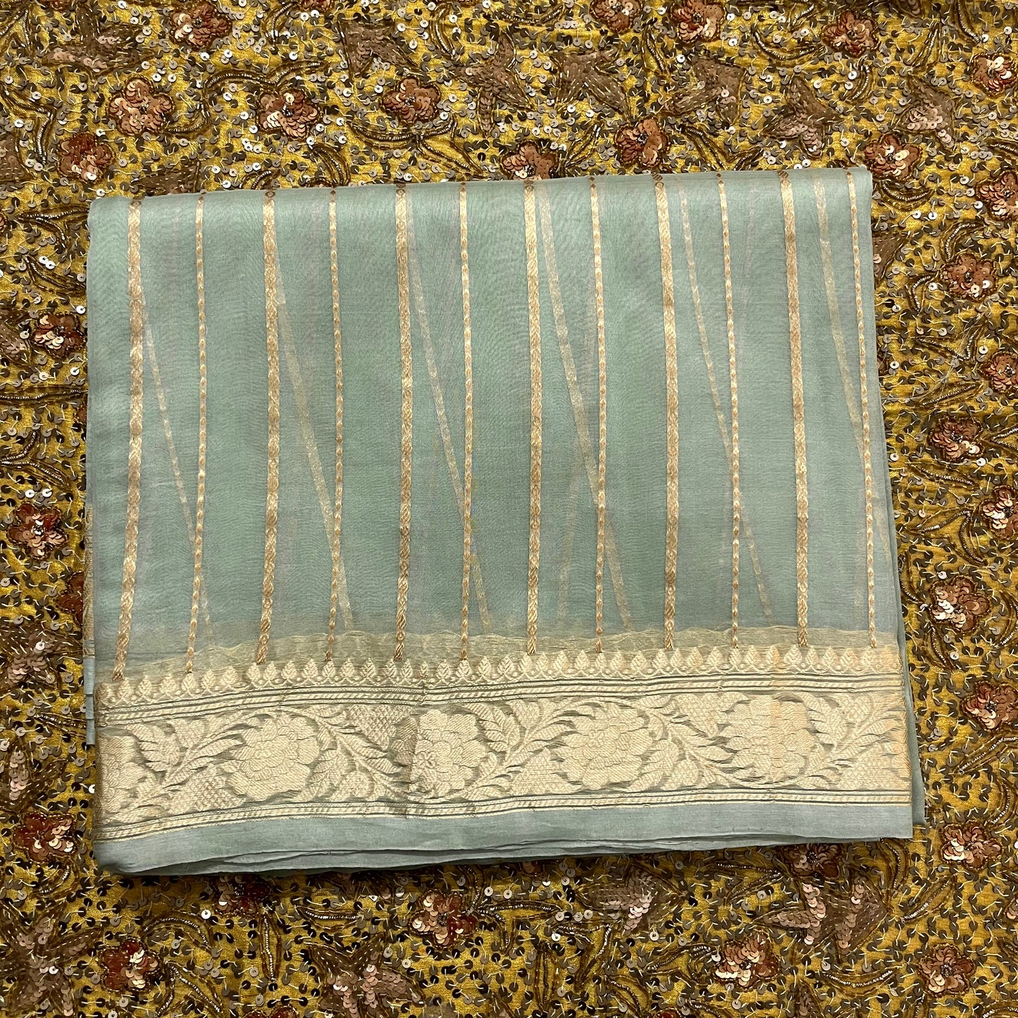 Sage green banarasi saree with zari stripes all over
