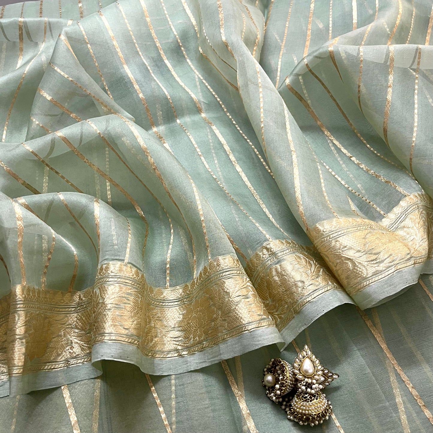Sage green banarasi saree with zari stripes all over