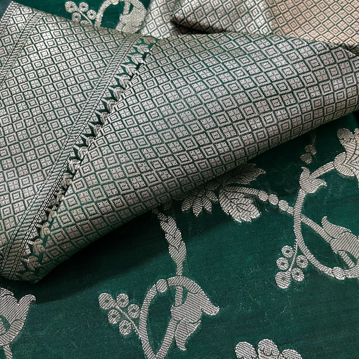 Dark green banarasi silk saree with zari pattern all over