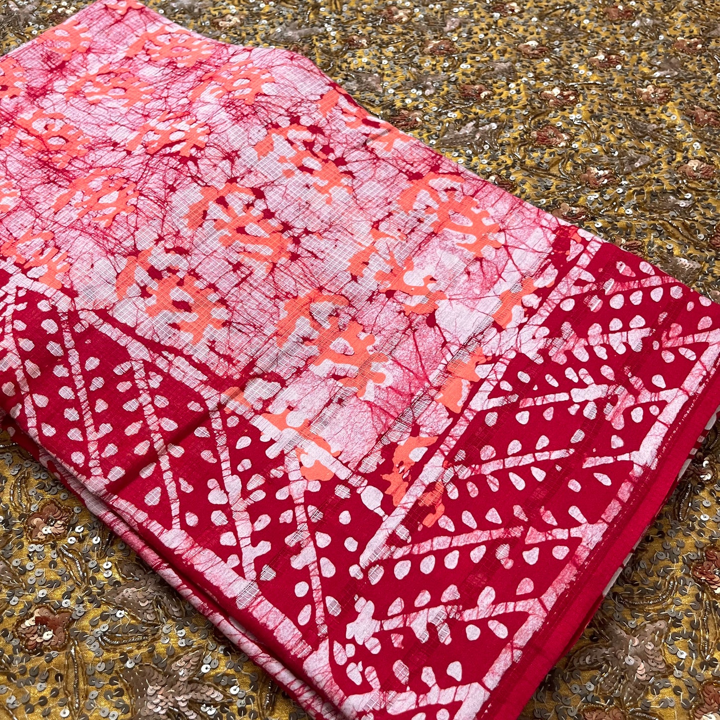 Off white, orange & red batik print saree