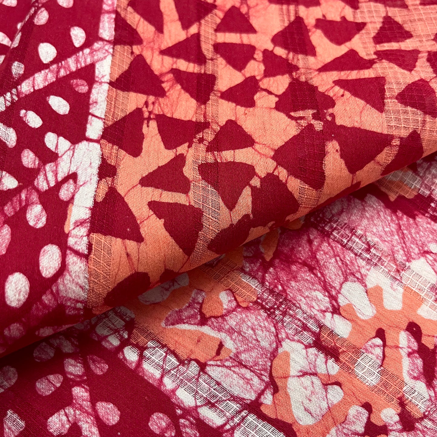 Off white, orange & red batik print saree