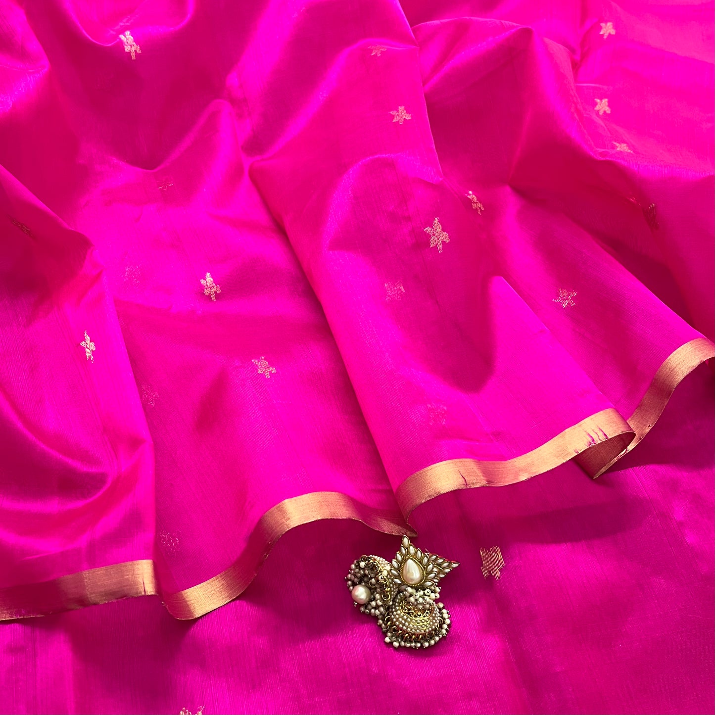 Rani pink chanderi silk saree with flower bootis all over