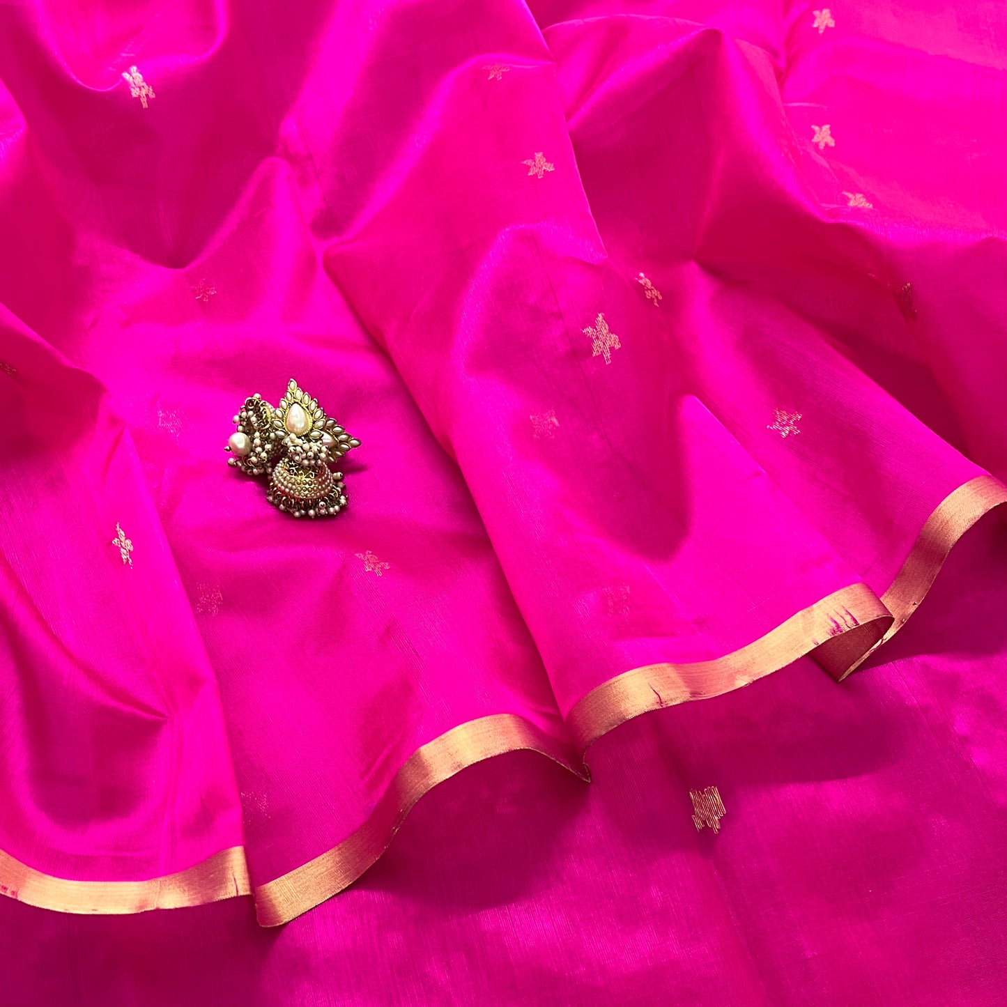 Rani pink chanderi silk saree with flower bootis all over