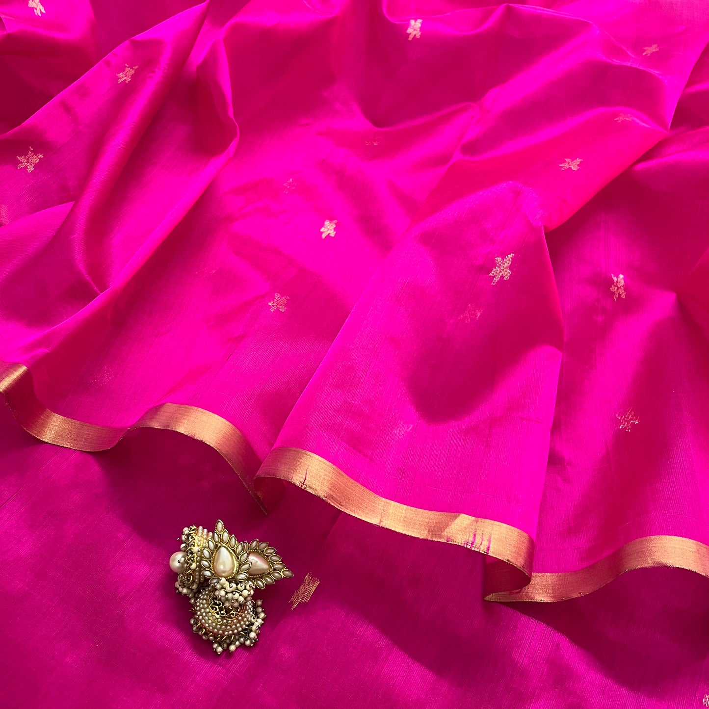 Rani pink chanderi silk saree with flower bootis all over